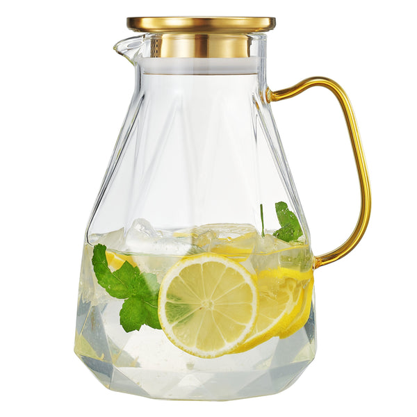Faceted Glass Pitcher Gold Lid styled on a marble bar cart with glassware