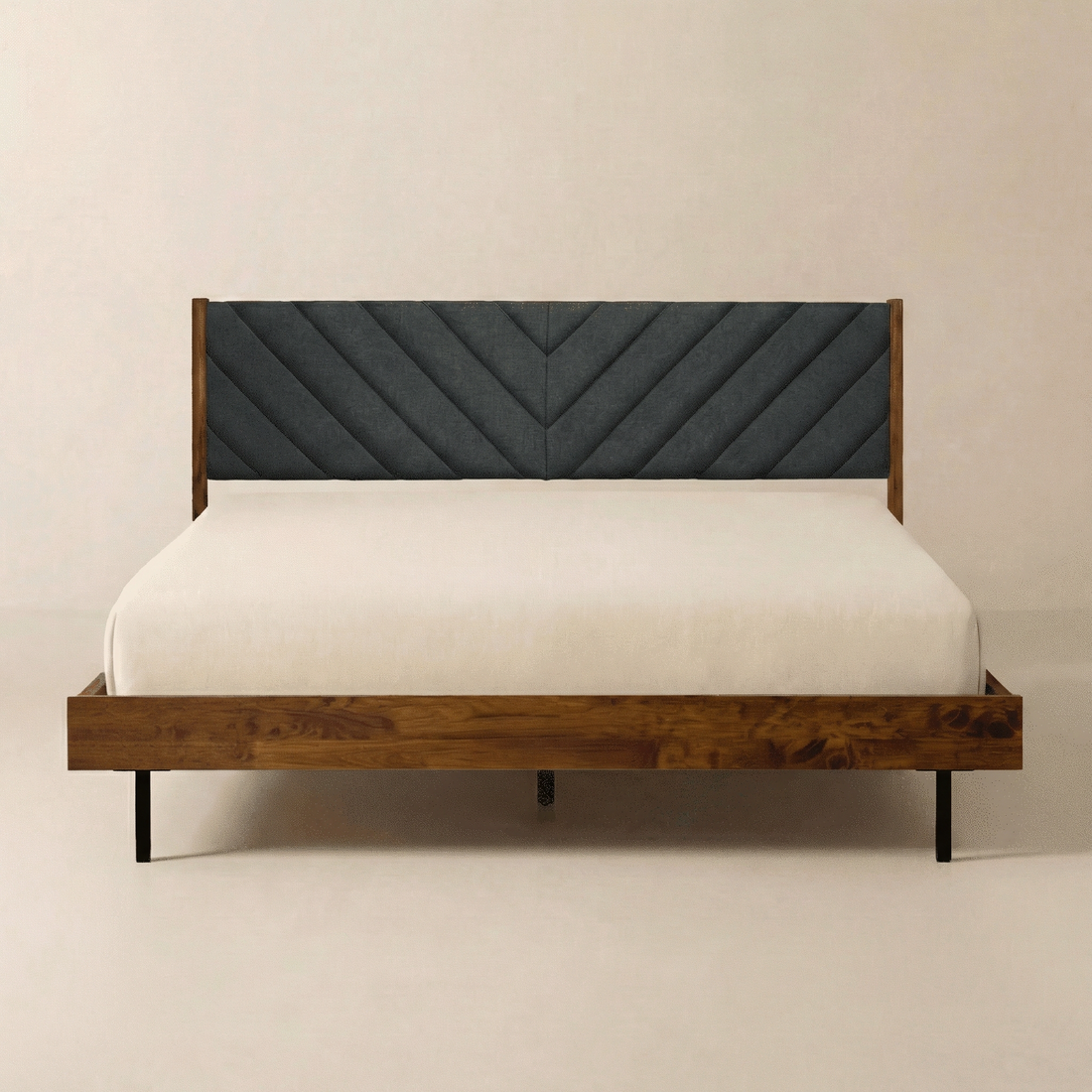 Chevron Upholstered Wood Platform Bed — Wood-grain platform bed with chevron-quilted charcoal headboard and matte-black legs