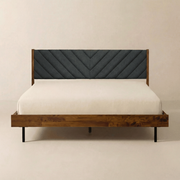 Chevron Upholstered Wood Platform Bed — Wood-grain platform bed with chevron-quilted charcoal headboard and matte-black legs