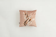 Blush Velvet Wheat-Print Throw Pillow layered on a neutral sofa with throw blanket