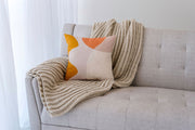 Abstract Print Linen-Blend Throw Pillow layered on a neutral sofa with throw blanket