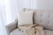 Abstract Print Linen-Blend Throw Pillow — alternate styling showing pillow grouped with coordinating textiles