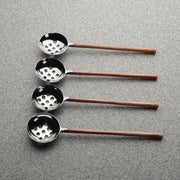 Copper-Finish Perforated Olive Spoon Set in a styled home setting