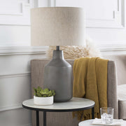 Concrete-Finish Linen Shade Table Lamp — styled in a complete room vignette