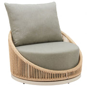 Woven Rattan Swivel Outdoor Accent Chair styled in an outdoor living space