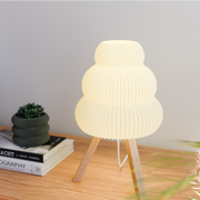 Sculpted Shade Tripod Table Lamp — alternate color temperature setting