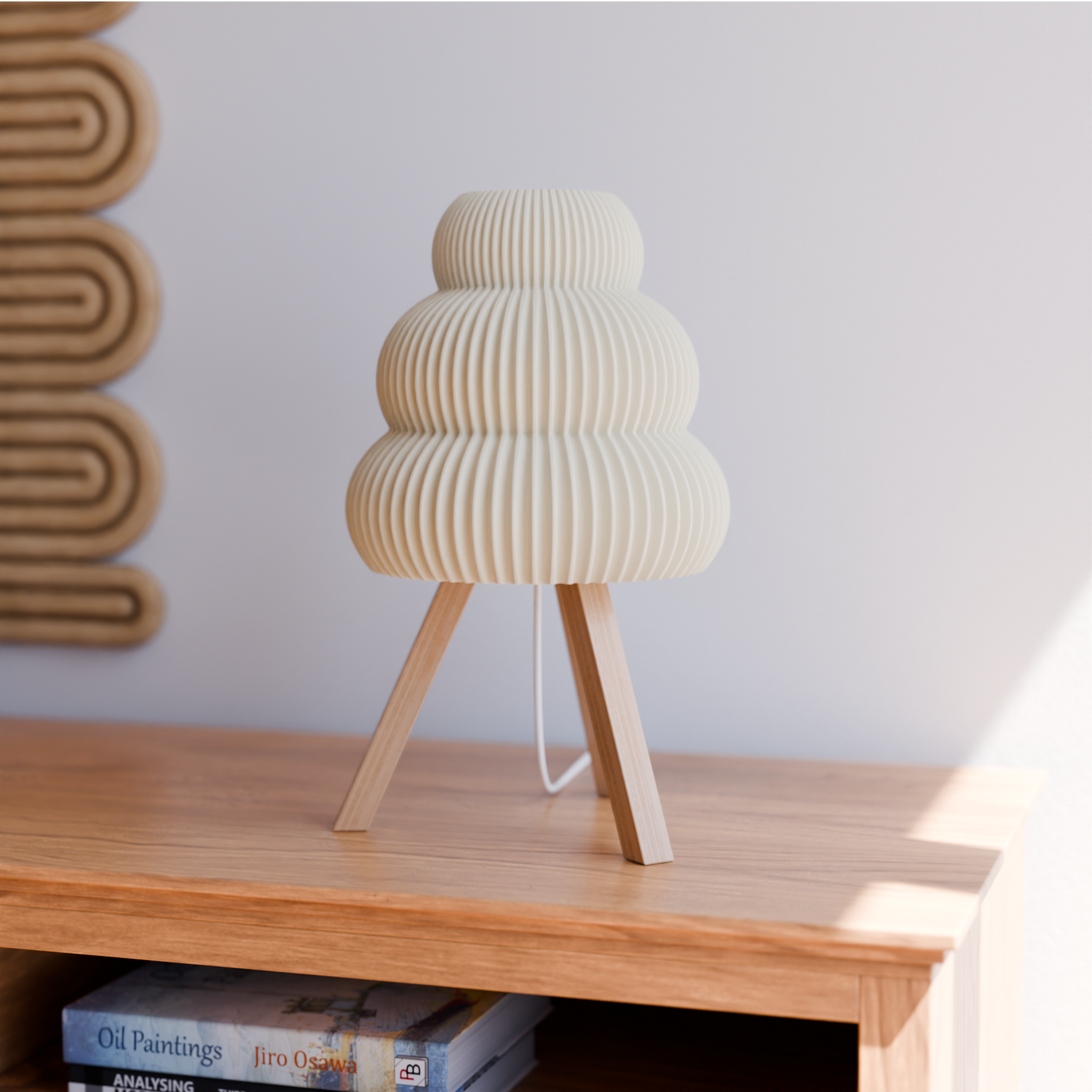 Sculpted Shade Tripod Table Lamp — Ribbed cloud-form shade on splayed wood-grain legs for soft ambient light