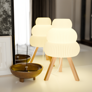 Sculpted Shade Tripod Table Lamp styled with ceramics and a linen runner