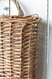 Woven Willow Wall Basket — Hand-woven willow wall basket, flat-backed with a looped hanging handle