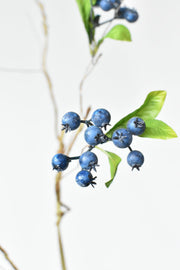 Dusty Blue Faux Berry Stem in a styled home setting