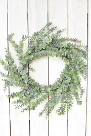 Faux Eucalyptus Round Wreath — Wired faux eucalyptus wreath with a botanical gray-green tone for door or wall