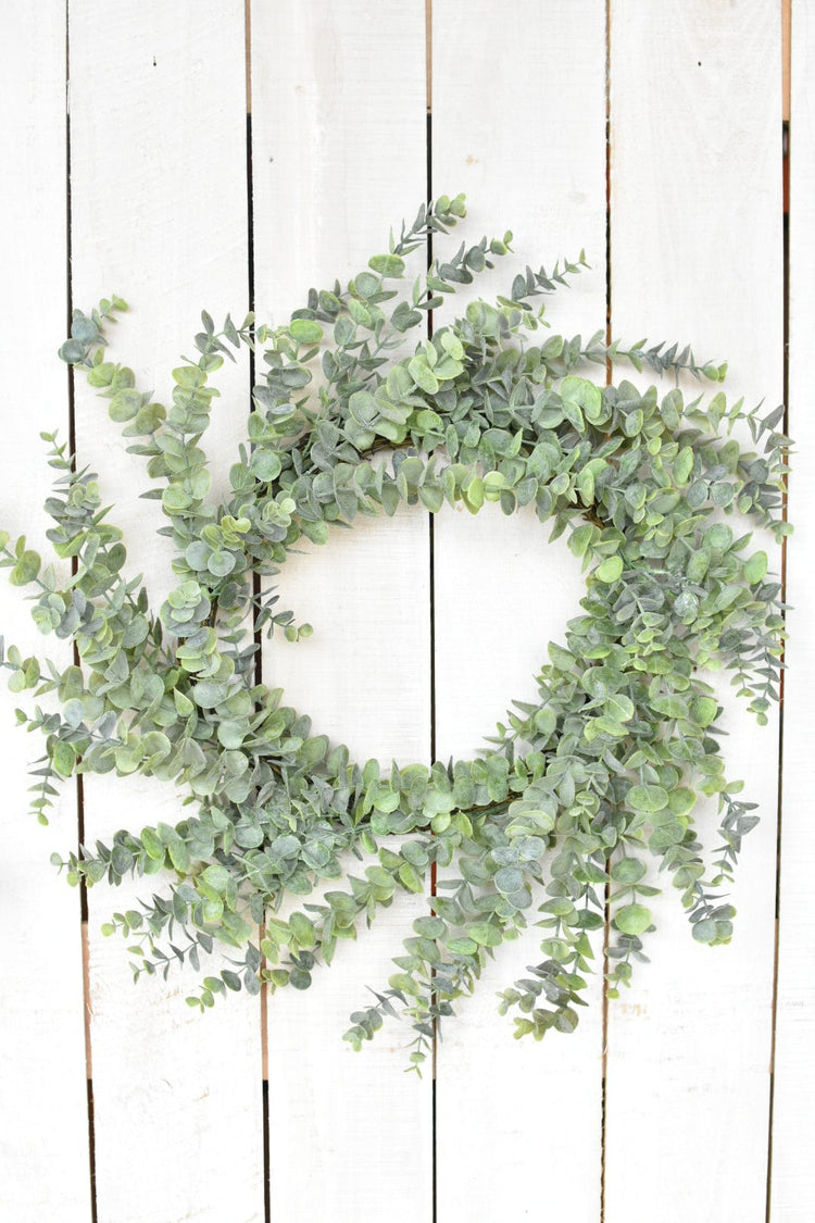 Faux Eucalyptus Round Wreath — Wired faux eucalyptus wreath with a botanical gray-green tone for door or wall