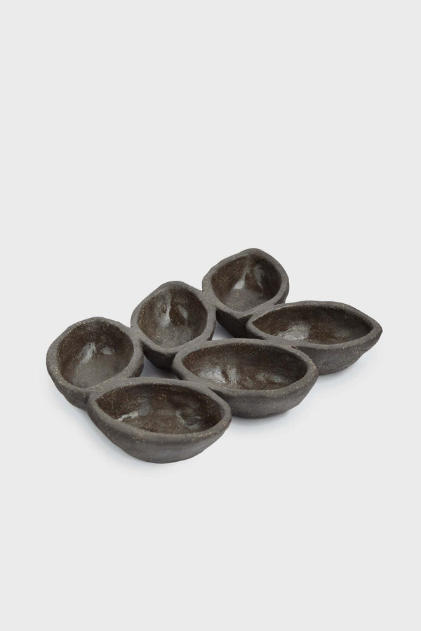 Dark Stoneware Multi-Well Serving Dish in a styled home setting