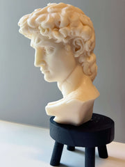 Sculptural Bust Figure Candle styled on a table with linen and ceramics