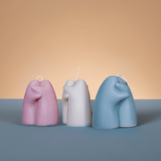 Sculptural Hugging Figure Soy Candle styled on a table with linen and ceramics