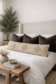 Bobble-Weave Oversized Lumbar Pillow Cover layered on a neutral sofa with throw blanket