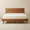 Herringbone Wood Platform Bed Frame — Low-profile platform frame with a mirrored herringbone wood-grain headboard