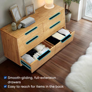 Carved Hevea Wood Six-Drawer Dresser styled in a bedroom with a ceramic dish and candle