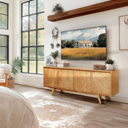 Relief-Carved Wood TV Stand in a styled home setting