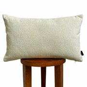 Cream Sherpa Lumbar Pillow Cover layered on a neutral sofa with throw blanket