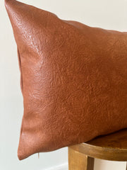 Cognac Faux Leather Lumbar Cover in a styled home setting