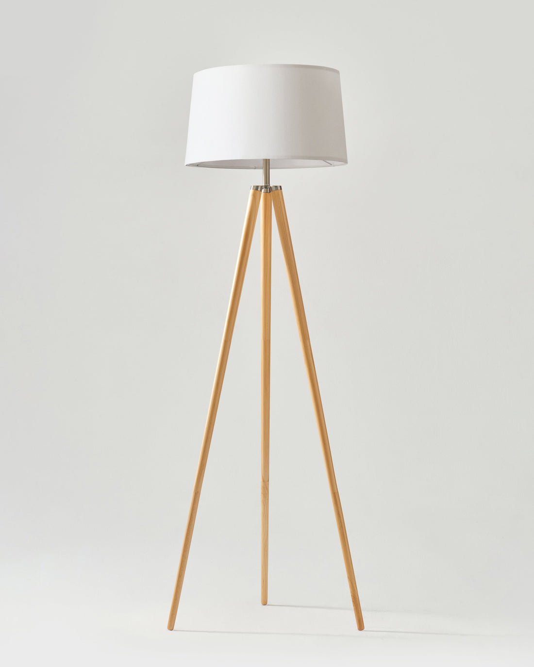 Linen Shade Tripod Floor Lamp — Tapered tripod floor lamp with fabric shade and warm wood-finish legs
