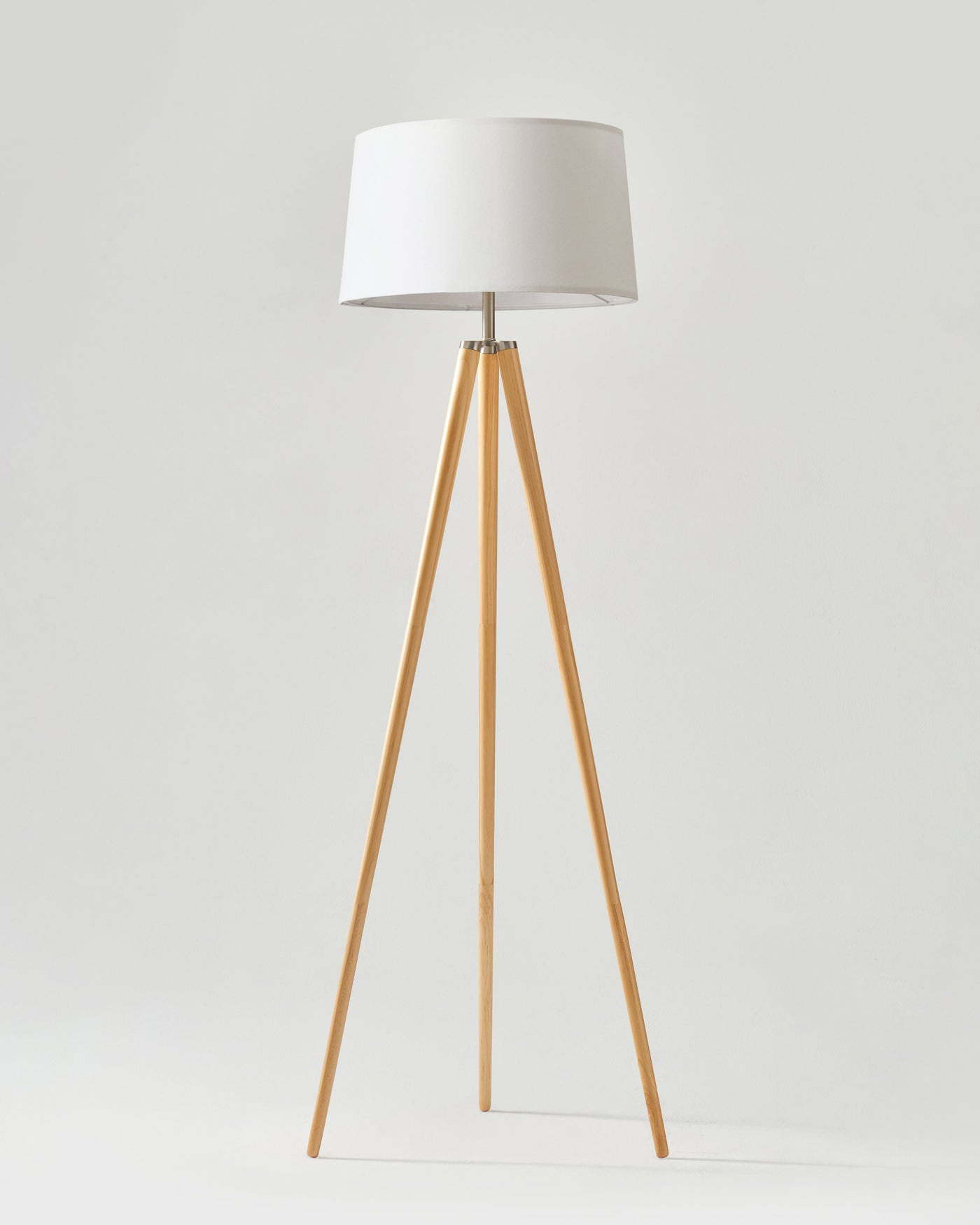 Linen Shade Tripod Floor Lamp — Tapered tripod floor lamp with fabric shade and warm wood-finish legs