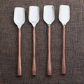 Wood-Handle Steel Cheese Scoop Set — Four steel cheese scoops with faceted wood-grain handles for crumbly varieties
