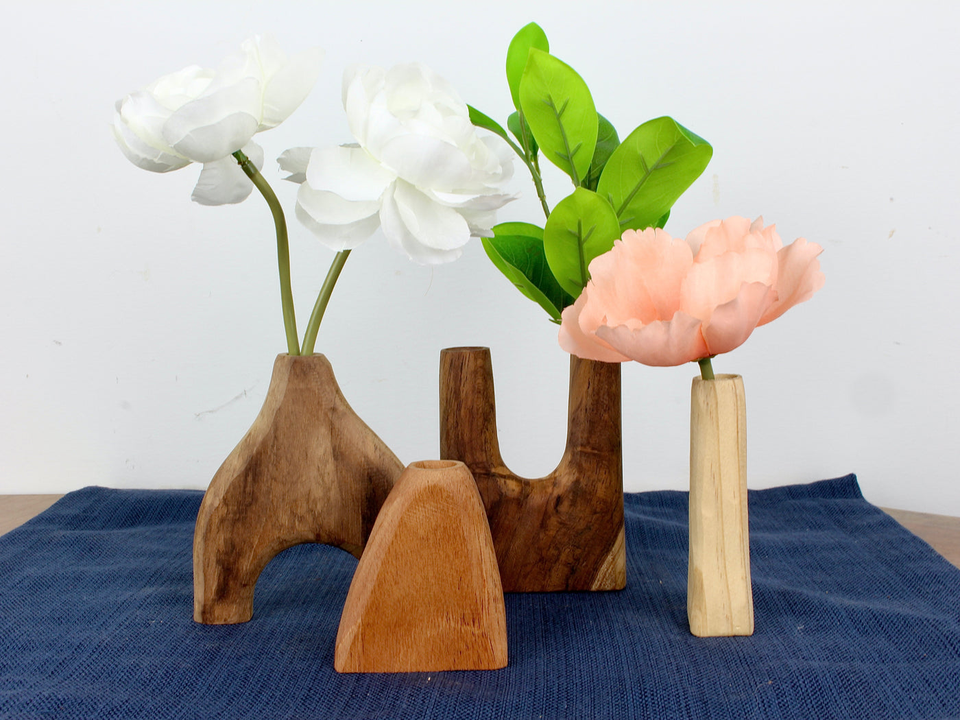 Hand-Carved Mixed Wood Dry Vase Set — Four hand-carved wood vases in varied timbers, made for dried stems