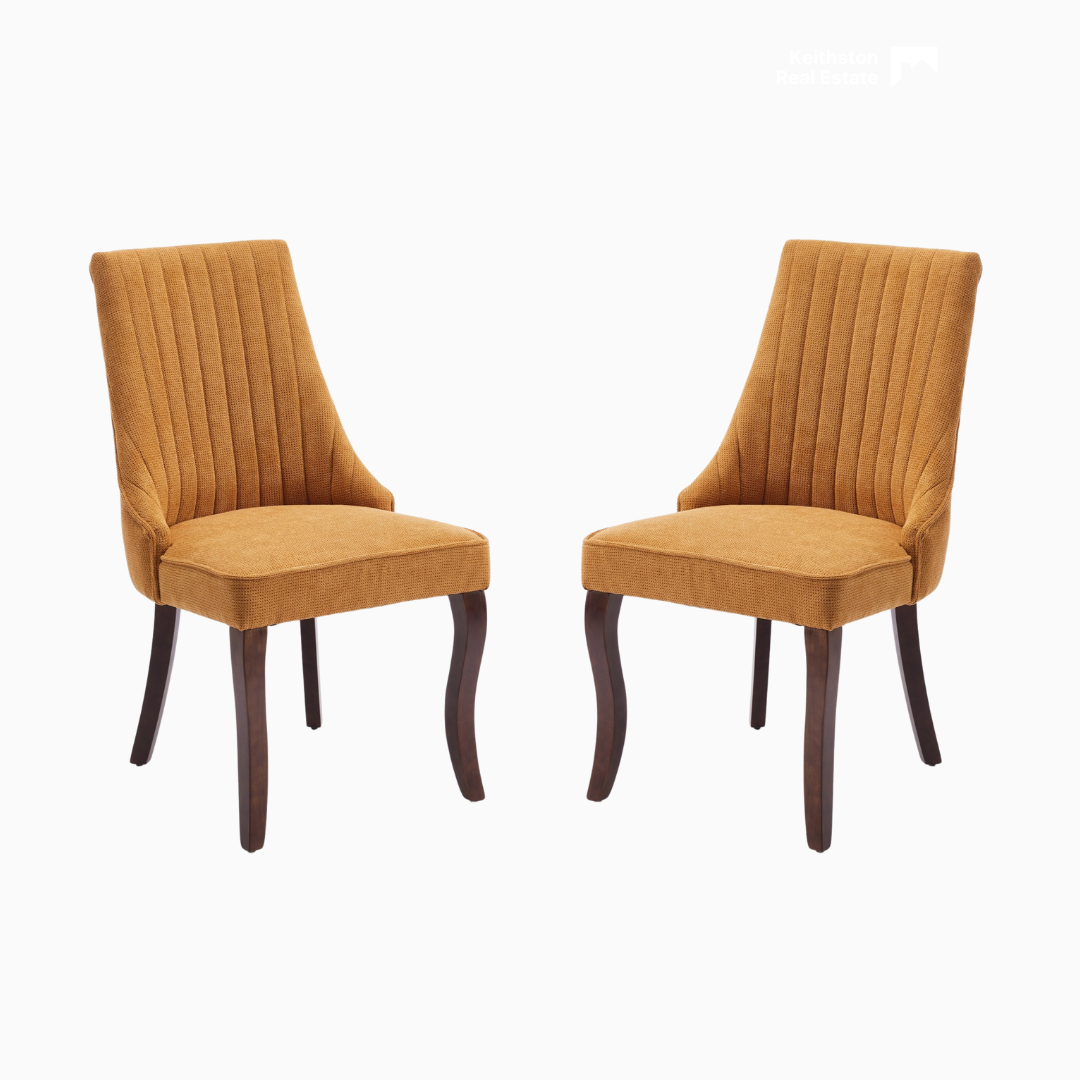 Channel-Tufted Ochre Upholstered Dining Chairs styled in an outdoor dining setting