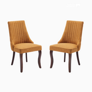 Channel-Tufted Ochre Upholstered Dining Chairs styled in an outdoor dining setting
