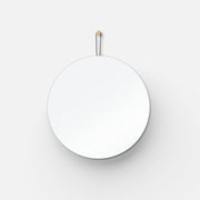 Brass-Hook Round Wall Mirror hung above a console table with ceramics