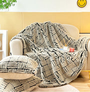 Basket-Weave Faux Fur Throw draped over a linen sofa arm