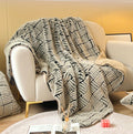 Basket-Weave Faux Fur Throw — Raised-relief faux fur throw in oat and charcoal with fleece lining