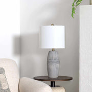 Ribbed Ceramic Table Lamp styled with linen bedding in a warm bedroom