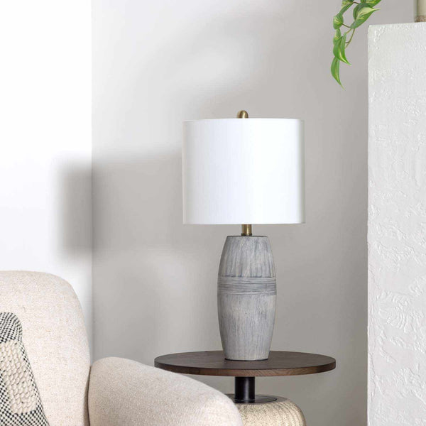 Ribbed Ceramic Table Lamp styled with linen bedding in a warm bedroom