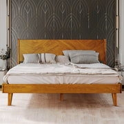 Herringbone Wood Platform Bed Frame styled with linen bedding in a warm bedroom