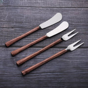 Textured Handle Cheese Tool Set — Four-piece cheese set with wood-grain handles and polished steel blades