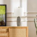 Ribbed Ceramic Table Lamp — Ribbed ceramic base in ash-grey with brass column and white fabric shade