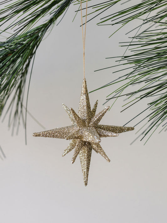 Gold ornament with glitter, starburst