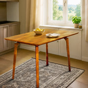 Curved-Leg Solid Wood Dining Table — styled in a complete room vignette