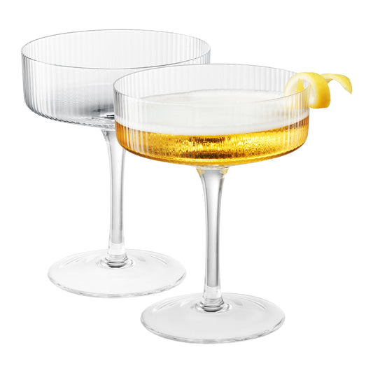 Ribbed Glass Coupe Set styled with linen bedding in a warm bedroom