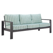 Striped Olefin Outdoor Sofa styled in an outdoor living space