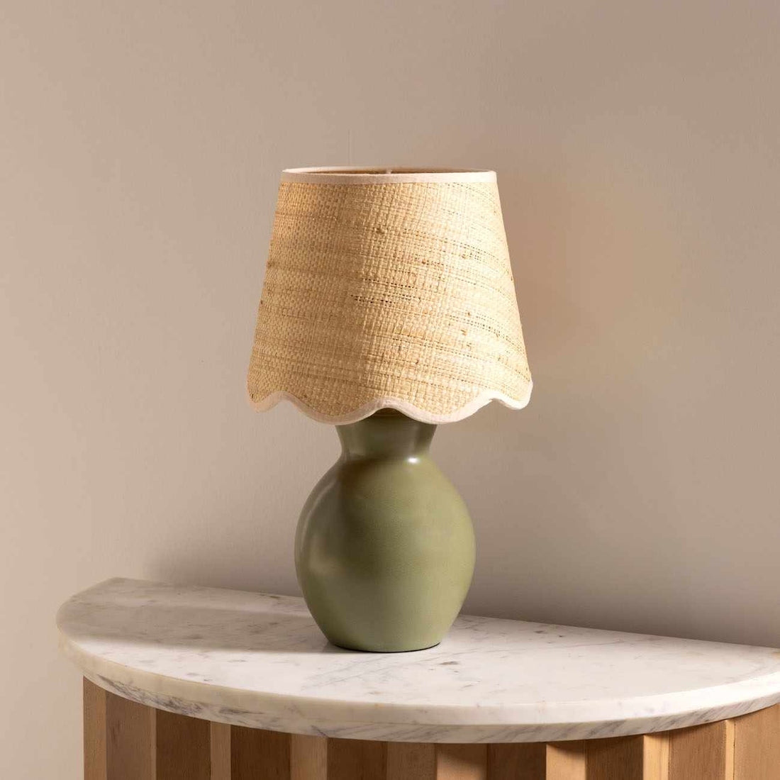 Matte Ceramic Scallop-Shade Table Lamp — Sage ceramic base and scallop-edged rattan shade for gentle, grounded light