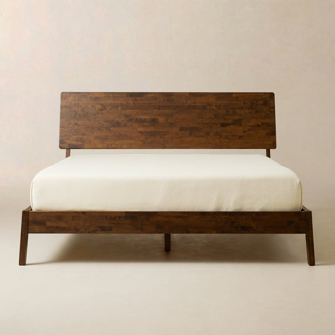 Solid Wood Platform Bed Frame — Low-profile solid wood platform frame with wide-plank headboard and slatted base