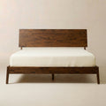 Solid Wood Platform Bed Frame — Low-profile solid wood platform frame with wide-plank headboard and slatted base