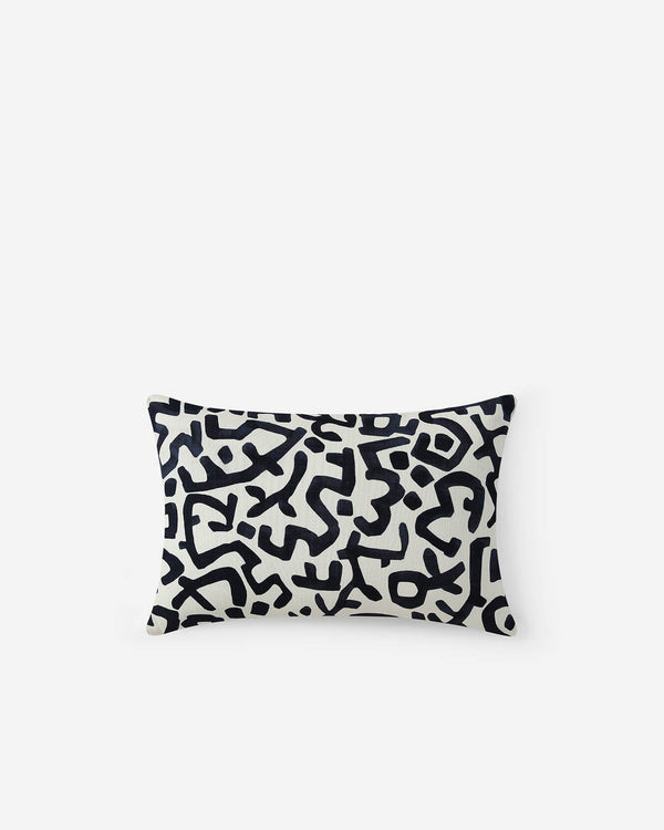 Cream lumbar pillow with abstract geometric shapes, rectangular