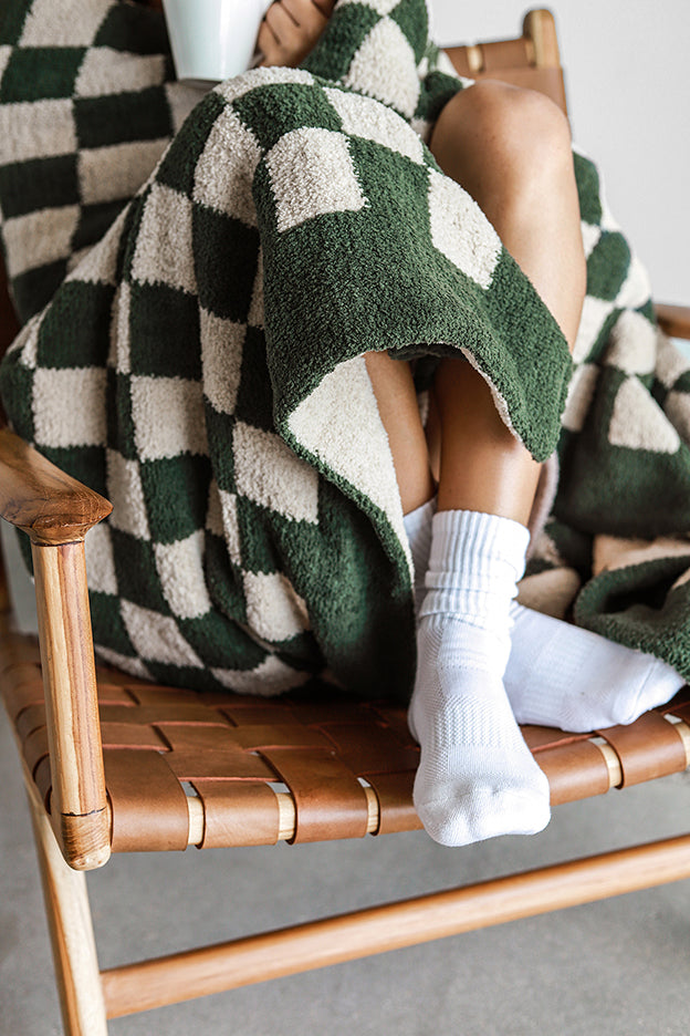 The throw that earns its corner of the chair