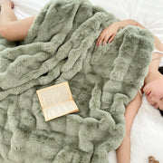 Quilted Faux-Fur Pile Throw — close-up of label and production detail