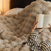 Sculpted Bubble-Pile Plush Throw draped over a linen sofa arm